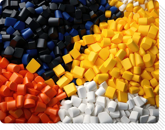 A close-up arrangement of small cuboid foam or plastic pieces in several colors, including black, blue, yellow, orange, white, and some mixed-color pieces, filling the frame.
